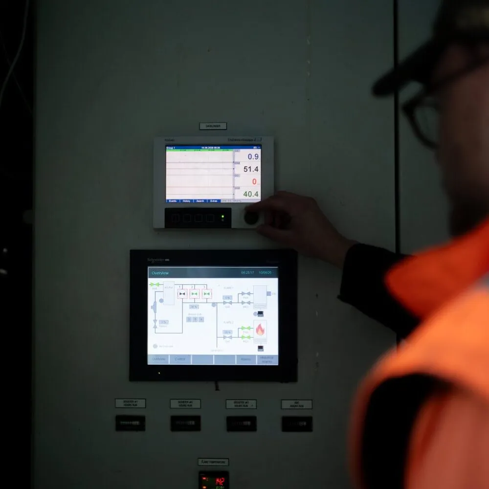 Operator adjusting controls at the energy park