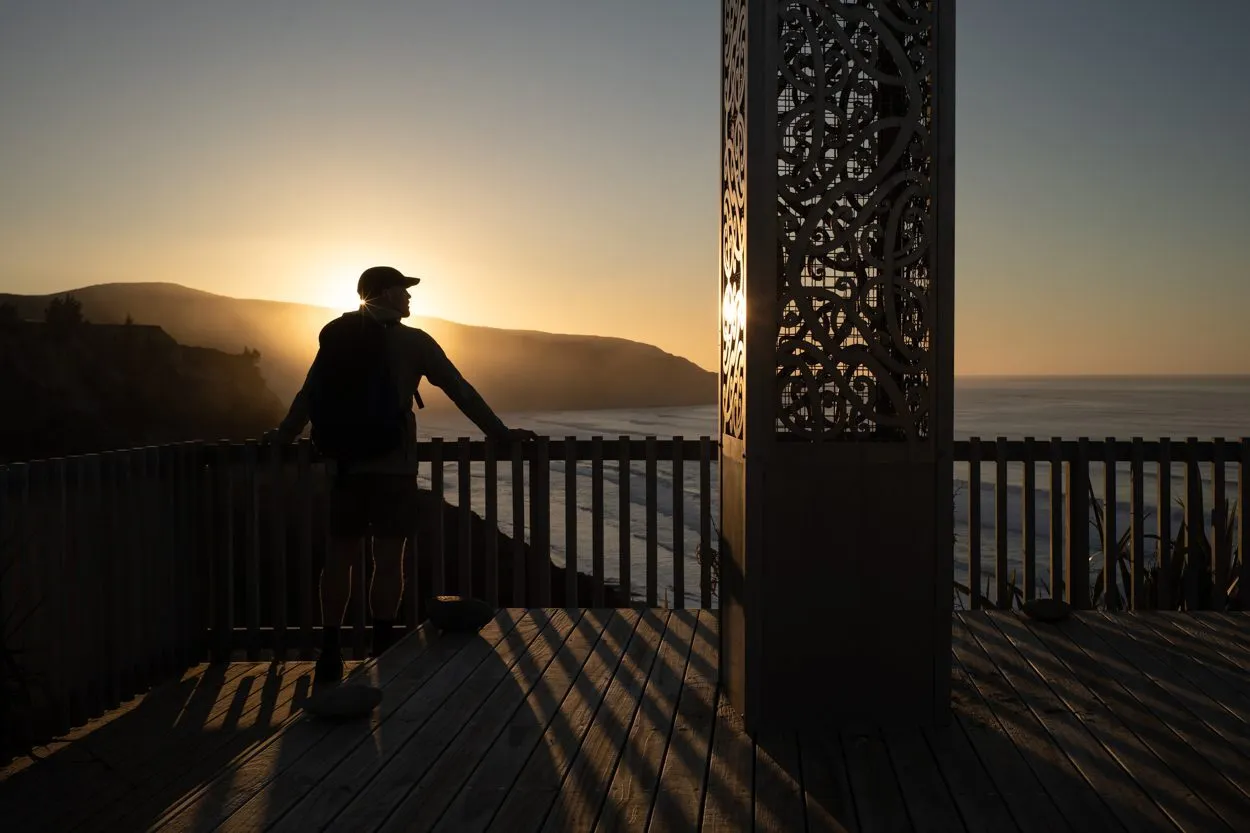 Visitor at the Tiromoana lookout at sunset